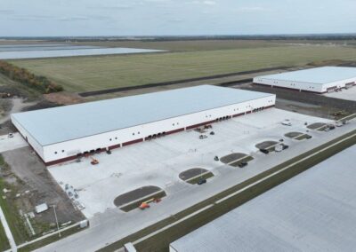 aerial photo of 3601 46th Ave N, Fargo showing the parking area for trucks and employees as well as the access points from the road